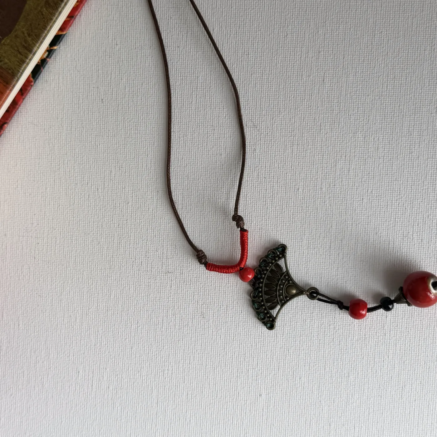 Bronze Fan & Red Bead